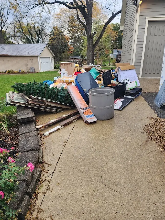 Dumpster being loaded with debris for 3 Yard Dumpster Rental in Schoolcraft